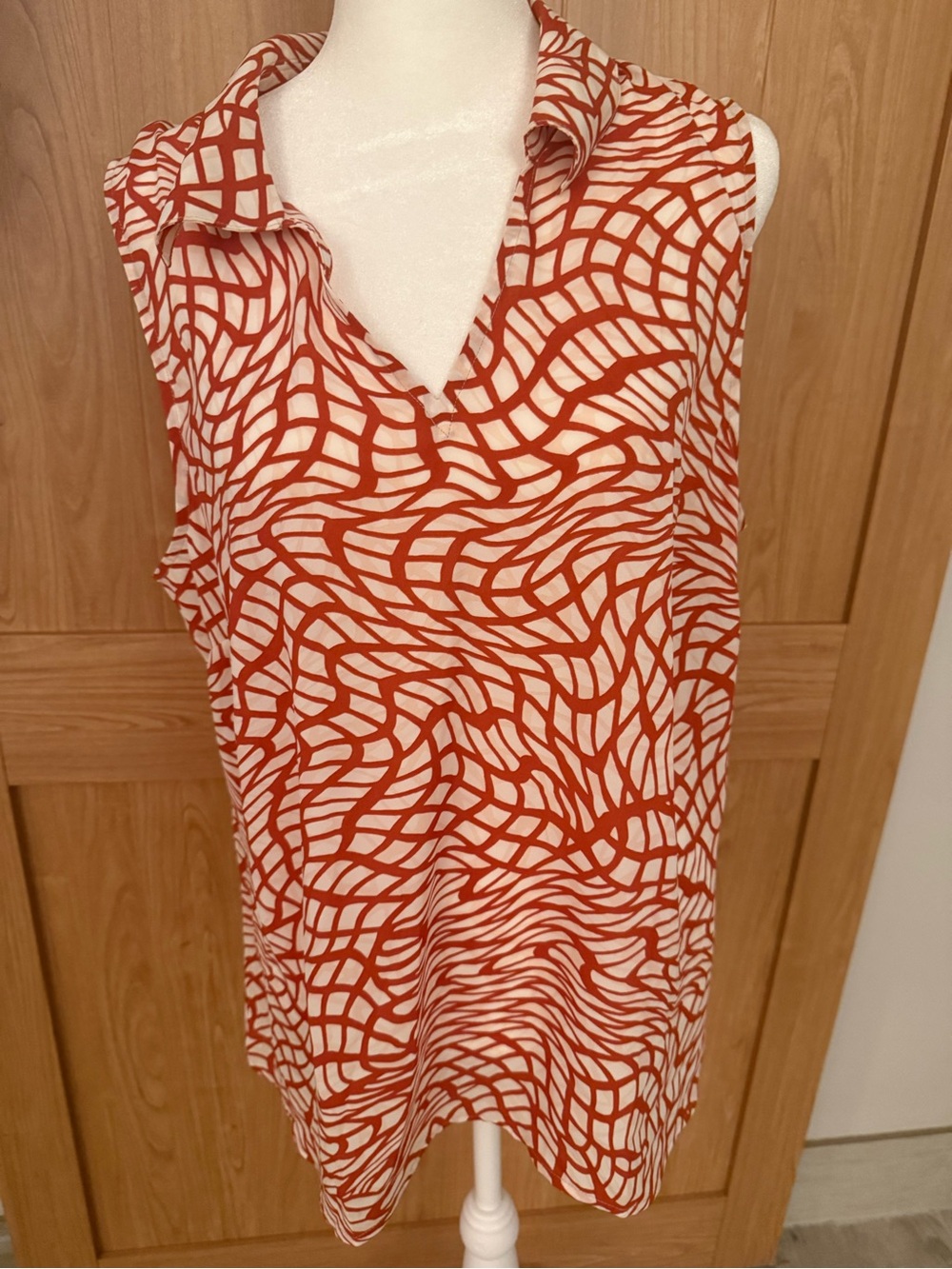 CAbi Sleeveless V-Neck sleeveless blouse in Rust and Cream Abstract Print